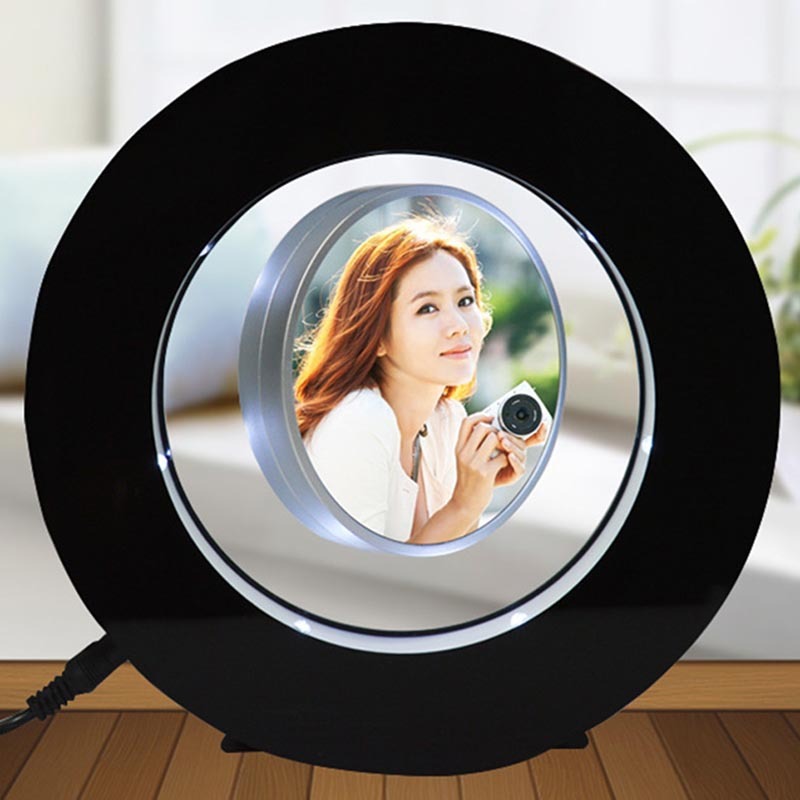 Magnetic levitation miniature photo frame with black ABS plastic body, LED lights, and floating circular photo display