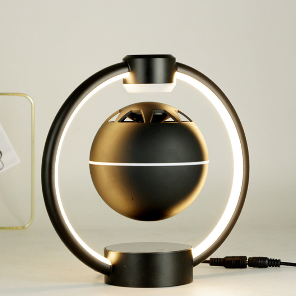 Magnetic levitation Bluetooth speaker with circular LED light and floating spherical design in black for wireless audio and home decoration