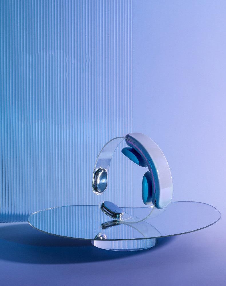 Blue and white intelligent neck protector hot compress pulse multifunctional massager with USB power supply on reflective surface